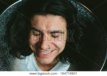 Male model wearing fooling around his neck reflector diffuser. Dog Recovery Collar Cones