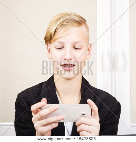 Teenager with phone in hands. Internet dependence computer games