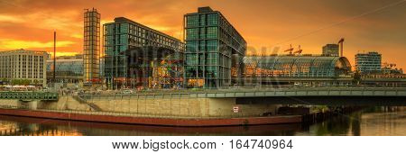 Panoramic view of Berlin skyline and river at sunset
