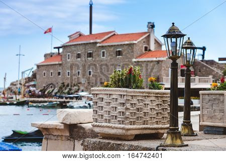 Coast venetian fortress Castello in Petrovac, Montenegro - popular tourist attraction. Old citadel, embankment and quay in Petrovac.