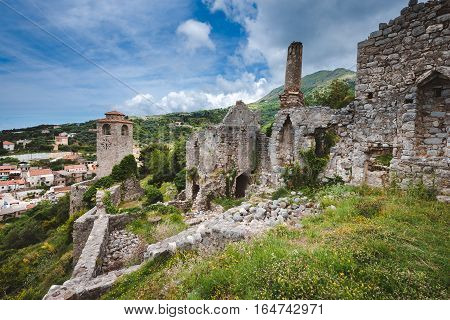 Ancient stone ruins and clock tower at Old Bar town, Montenegro. Stari Bar - ruined medieval city on Adriatic coast, Unesco World Heritage Site.