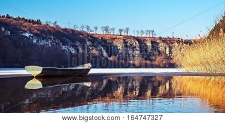 Empty fishing boat on lake. Rusenski Lom Natural Park, Ruse district, Bulgaria.