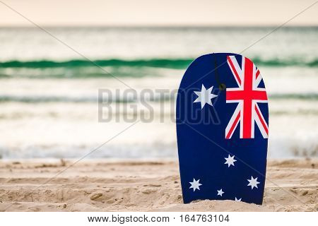 Surfing board with Australian flag at the beach