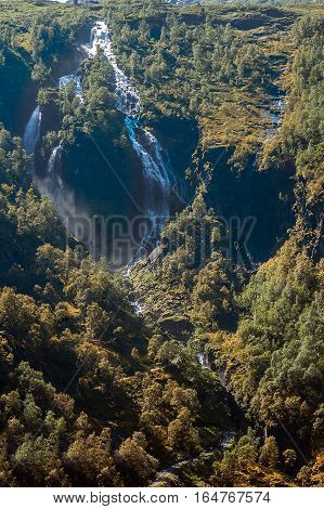 Norway Flom railway from station Flom to station Myrdal the length of 20 km . Gorges waterfalls mountain rivers valleys with water meadows and tunnels .