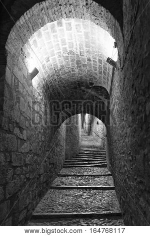 Girona (Gerona Catalunya Spain): old typical street by night. Black and white
