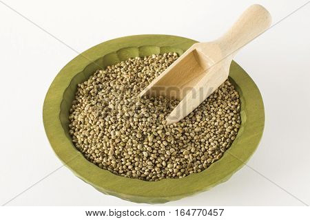 raw hemp cannabis seeds wooden laddle close up