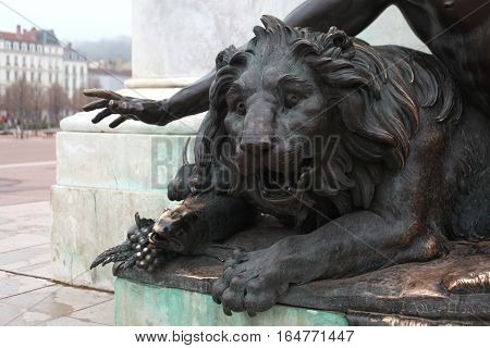 lion - a symbol of the city of Lyon.  Detail of the monument to King Louis XIV in Lyon, France