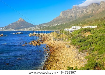 View of Sentinel peak in Hout Bay from the scenic Chapman's Peak Drive, Cape Town, South Africa in a sunny day.