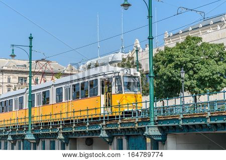 Yellow tram moving in the city. Budapest Hungary.