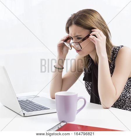 Young executive working in the office at the computer