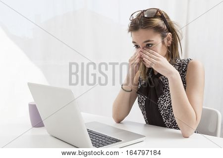 Young executive working in the office at the computer