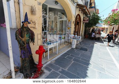 Rethymnon, Island Crete, Greece- July 1 2016: The scarecrow near the store on narrow street of Rethymnon (part of Old Town) where there are a lot of small cafes and shops
