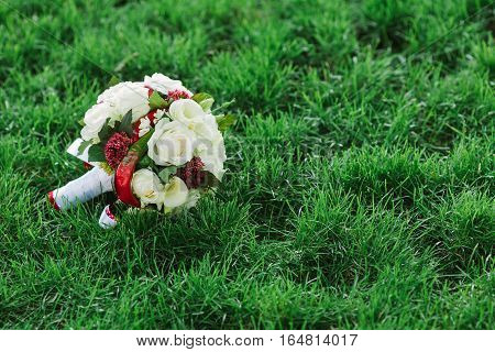 Flower composition. flower background. spring background. beautiful bouquet of flowers. wedding bouquet on a green grass.