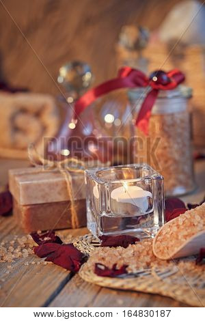 Composition of spa treatment. Natural handmade soap and sea salt with fragrant herbs. Spa concept.