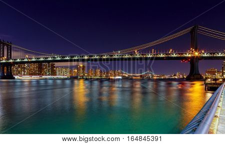Panorama of Manhattan Bridge in New York City at night Brooklyn and Manhattan and Williamsburg bridges span across the East River
