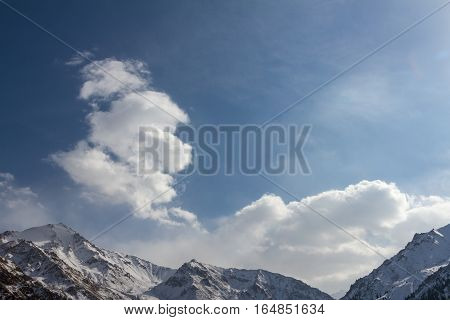 Clouds Over Mountain Peaks