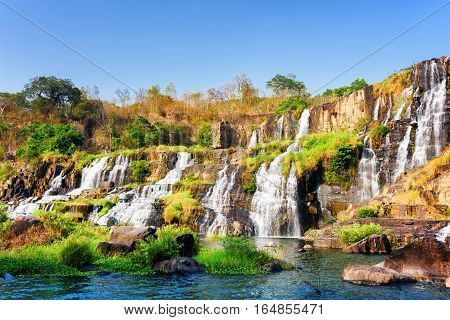 Beautiful View Of Natural Cascading Waterfall In Autumn