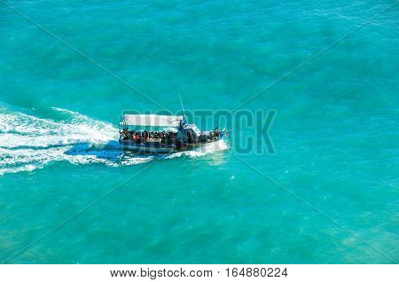 Fishing boat drifted in the sea. Turquoise sea