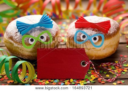 Carnival doughnuts with funny faces and copyspace