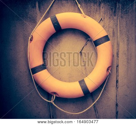 Orange lifebuoy All Water rescue emergency equipment. sport background