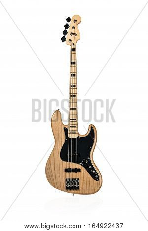 Wooden electric bass with a black plate standing vertically isolated on white background