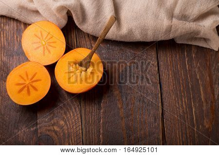 Diospyros Kaki On Rustic Wooden Background