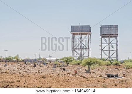 JACOBSDAL SOUTH AFRICA - DECEMBER 31 2016: Water reservoirs and a cemetery in Jacobsdal a small town in the Free State Province