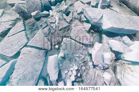 Texture background ice cracks and hummocks of Baikal.