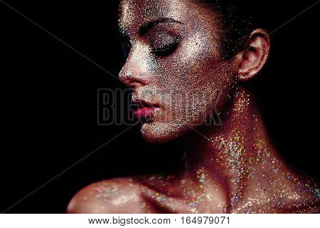 Portrait Of Beautiful Woman With Sparkles On Her Face