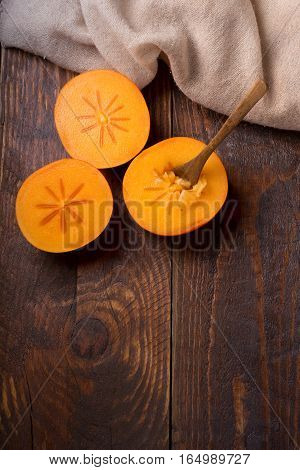 Diospyros Kaki On Rustic Wooden Background