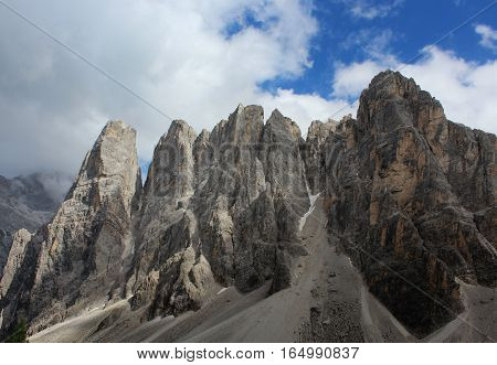 Up hill Mountains of Italy Dolomites with sky.