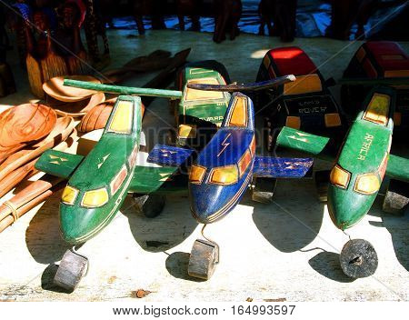 Hazyview, South Africa - April 25, 2014: African handmade toys helicopters planes and cars on the local craft market in the Hazyview South Africa. Modern tribal art.