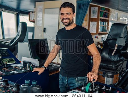 Marine Navigational Officer Is Maneuvering Ship Or Vessel