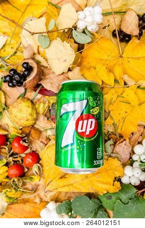 Saint-petersburg, Russia, 17102018 Drink 7up In A Glass Tin Bottle On Autumn Yellow Green Foliage Of