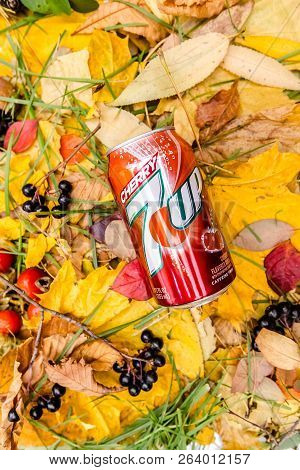 Saint-petersburg, Russia, 17102018 Drink 7up In A Glass Tin Bottle On Autumn Yellow Green Foliage Of
