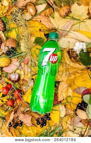 Saint-petersburg, Russia, 17102018 Drink 7up In A Glass Tin Bottle On Autumn Yellow Green Foliage Of
