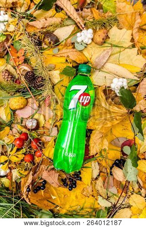 Saint-petersburg, Russia, 17102018 Drink 7up In A Glass Tin Bottle On Autumn Yellow Green Foliage Of