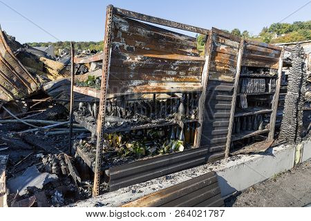 Damaged Industry Supermarket Metallic Facade After Arson Fire With Burnt Debris After Intense Burnin