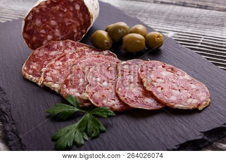 Saucisson Sec Delicious French Salami On A Wooden Background