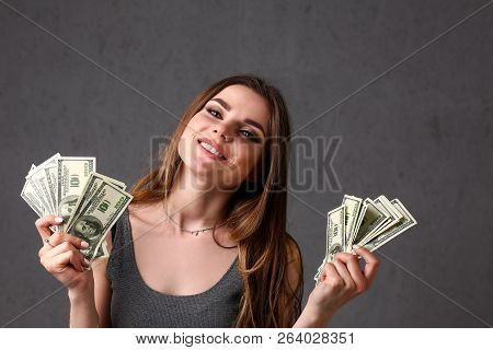 Beautiful European Woman Portrait. Scattering Money Notes Dollars In Fashion Vows Style  Curly Hair 