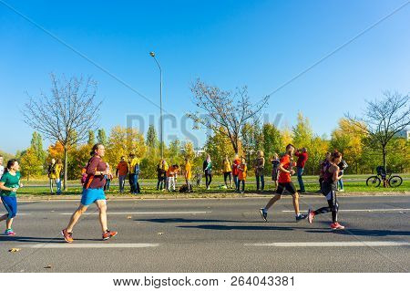 Poznan, Poland - October 14, 2018: Many People Running On A Street During The Pko Poznan Marathon On