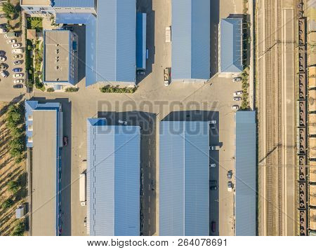 Aerial Top View Of Warehouses Hangars Near The Industrial Factory Zone