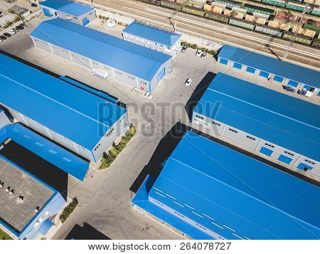 Aerial Top View Of Warehouses Hangars Near The Industrial Factory Zone