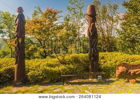 Samcheok, South Korea; September 25, 2018: Two Phallic Shaped Wooden Statues Standing In Behind Park