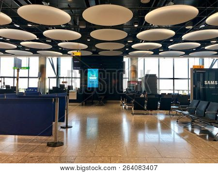 HEATHROW AIRPORT, LONDON - OCTOBER 3, 2018: Seating at a boarding gate inside Heathrow Terminal 5 in London, UK.