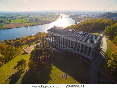 DONAUSTAUF / GERMANY - OCTOBER 14, 2018: The Walhalla is a hall of fame that honors laudable and distinguished people in German history. The hall is a neo-classical building above the Danube River.