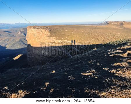 Travel To North Caucasus Region Region - Shadows Of People And View Of Bermamyt Mountain Plateau At 