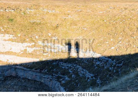 Travel To North Caucasus Region Region - Shadows Of People On A Rock Of Bermamyt Mountain Plateau At