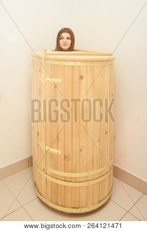 Barrel Cedar. Wellness Spa Sauna. Aromatherapy Treatment. Young Beauty Woman. Girl Face