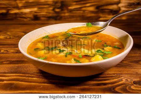 Georgian Traditional Food Soup Kharcho On Rustic Wooden Table